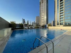 a large swimming pool on top of a building at Silkhaus homely 2BDR with stunning Downtown view with Balcony in Dubai