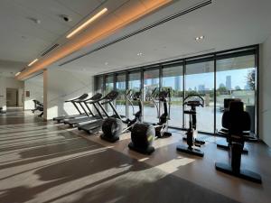 a gym with treadmills and ellipticals in a building at Silkhaus homely 2BDR with stunning Downtown view with Balcony in Dubai