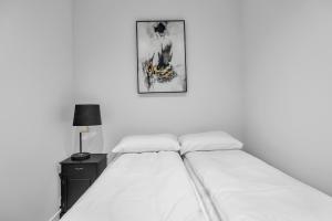 En eller flere senge i et værelse på The Nordic Hideaway