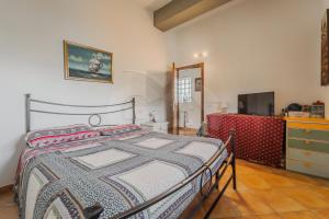 En eller flere senge i et værelse på Villino Girasole - Goelba