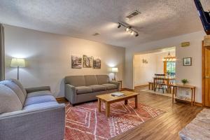 a living room with a couch and a table at Pool-Pinecrest Townhomes-Two Units-Dollywood-Renovated in Pigeon Forge