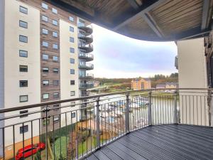 a balcony with a view of a building at Riverview Apartment in Cardiff