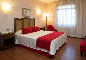 Postel nebo postele na pokoji v ubytování Hotel Pazo O Rial