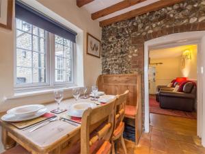a dining room with a wooden table and chairs at 3 Bed in Syderstone KT083 in Syderstone