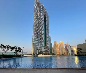 a rendering of a tall building in a city at Silkhaus with marina & beach view 1BDR near Bluewaters Island in Dubai