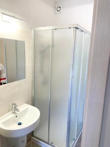 a bathroom with a shower and a sink at Sirmione Rosselli Apartments in Sirmione