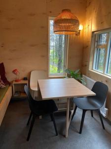 a dining room with a table and two chairs at Audkula Dome Cabin in Hella