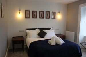 Postel nebo postele na pokoji v ubytování Conon Hotel