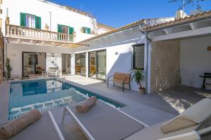 a swimming pool in the backyard of a house at 269 Son Moro ETV7750 by Mallorca Charme in Muro