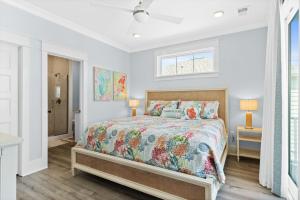 a bedroom with a bed and a window at Blue Heaven amazing custom home with private heated pool close to beach in Ocean Isle Beach +58 photos