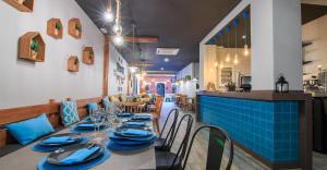 a dining room with a table with blue dishes on it at Al_andalus_404 in Alcossebre