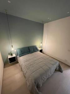A bed or beds in a room at Minimal house - 4persone - centro