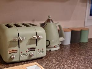 a toaster sitting on top of a kitchen counter at CASALIE at Seasalter Whitstable in Seasalter