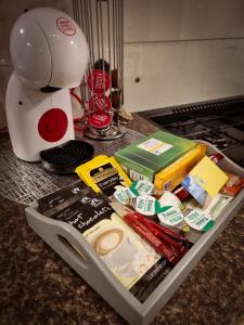 a drawer filled with food on a counter next to a mixer at CASALIE at Seasalter Whitstable in Seasalter