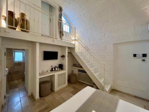 TV a/nebo společenská místnost v ubytování Vittorio Emanuele Charming Suites