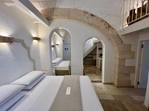 Postel nebo postele na pokoji v ubytování Vittorio Emanuele Charming Suites