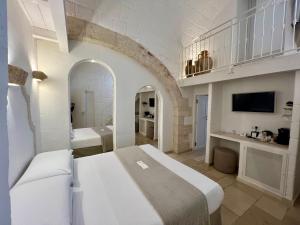 Postel nebo postele na pokoji v ubytování Vittorio Emanuele Charming Suites