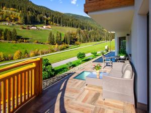 a balcony with a view of the mountains at Holiday Home Spieglhof-4 by Interhome in Sarntal