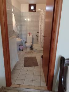Koupelna v ubytování Rooms Kakudia
