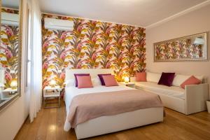 Ένα ή περισσότερα κρεβάτια σε δωμάτιο στο B&B Villa Rosa