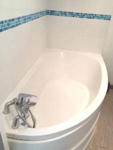 a bathroom with a white toilet and a sink at Maison de 3 chambres avec terrasse et wifi a Blere in Bléré