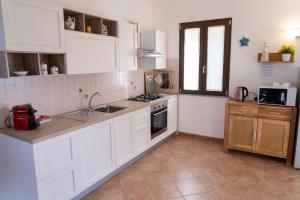 Kuchyň nebo kuchyňský kout v ubytování Casa Madì + 11 fotografií