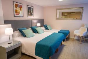 Posteľ alebo postele v izbe v ubytovaní B&B Villa Rosa