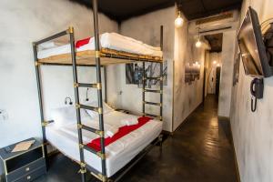 a room with two bunk beds and a hallway at Timeout Heritage Hotel Zagreb in Zagreb