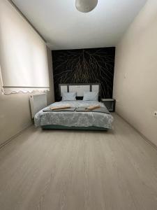 a bedroom with a large bed in a room at Trendhouse in Ankara