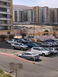 a bunch of cars parked in a parking lot at departamento Iquique in Iquique