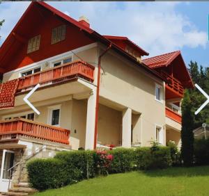 a house with a red roof at Luna House Busteni in Buşteni