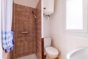 a bathroom with a shower and a toilet and a sink at Bourgarel in Vidauban