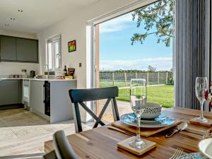 a kitchen and dining room with a table and a window at 4 Bed in Eden Valley 89353 in Little Salkeld