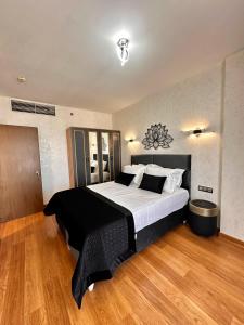 a bedroom with a large bed in a room at SABIHA GOKCEN HOTEL İSTANBUL HOUSES in Istanbul