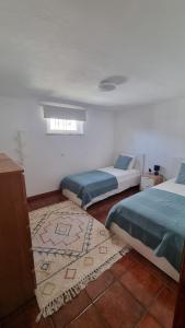 Giường trong phòng chung tại Retiro do Viajante