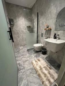 a bathroom with a sink and a toilet at Elite Apartment 3 in Riyadh
