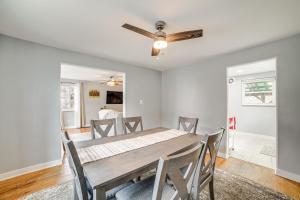 a dining room with a table and a ceiling fan at Penn Hills Home about 11 Mi to Pittsburgh 