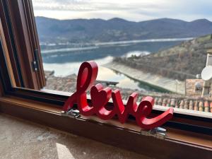 a window with the word rave written in red letters at La Dimora del Turano in Castel di Tora