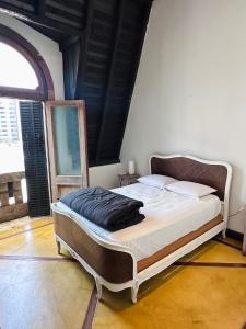 a bedroom with a large bed in a room at Parla Hostel in Buenos Aires