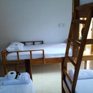 Katil atau katil-katil dalam bilik di Olamar Hostal
