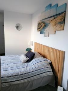 Postel nebo postele na pokoji v ubytování F2 Blanc Bleu