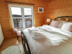 Voodi või voodid majutusasutuse Coastal Cabin toas