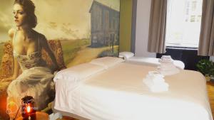 Postel nebo postele na pokoji v ubytování Apartments Chic Torino Centro porta nuova
