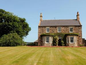 an old stone house with a large grass yard at 5 bed in Chirnside 77337 in Duns