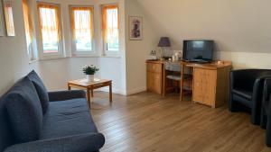 TV a/nebo společenská místnost v ubytování Hotel Garni