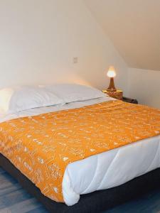 Un ou plusieurs lits dans un hébergement de l'établissement Gîte Maison Faure
