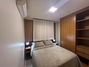 Ένα ή περισσότερα κρεβάτια σε δωμάτιο στο Conquista Executive Residence