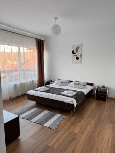 Un pat sau paturi într-o cameră la Vila Vibrant