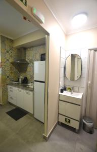 Kuchyň nebo kuchyňský kout v ubytování Rooms DP Setúbal