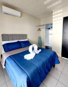 A bed or beds in a room at Bonita Casa en fraccionamiento privado cerca del aeropuerto